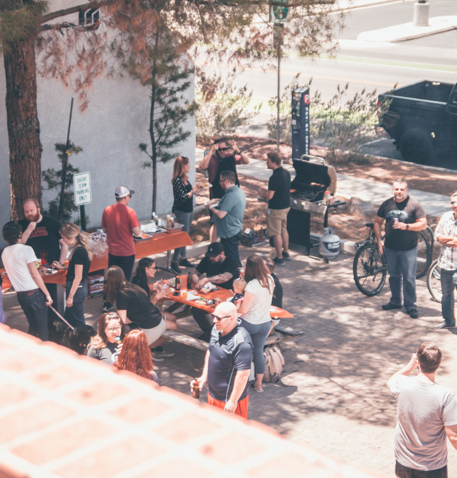 A group of people visiting an outdoor area near a clinic.